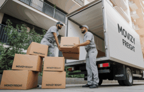 Movizy packers and movers team loading boxes into truck showing real charges and rates in Bangalore